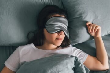 A girl wear a sleep mask